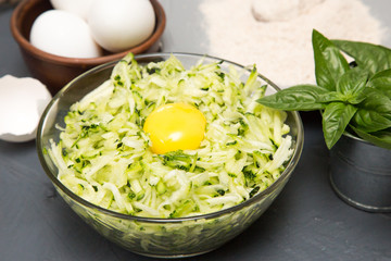 ingredients for zucchini pancakes - zucchini, eggs and flour