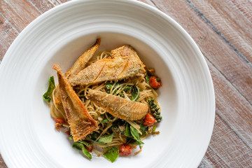 Thai style hot and spicy spaghetti with crispy fish