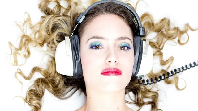 changing retro headphones on girls head