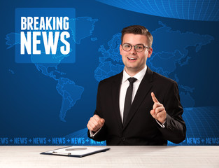 Television presenter in front telling breaking news with blue mo