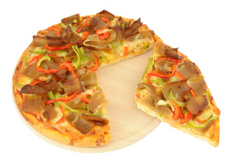 Doner meat and sweet pepper pizza on a wooden cutting board