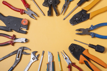 Set of electrical tool on wooden background. Accessories for engineering work, energy concept.