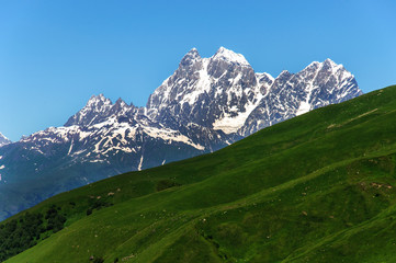 Fototapeta na wymiar Two peaks of Mount Ushba. Main Caucasian Ridge.