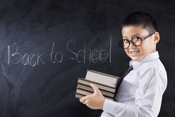 Child with books and text Back to School