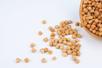 Close up dried chickpeas on a white background.