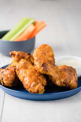 Buffalo chicken wings with celery carrot sticks