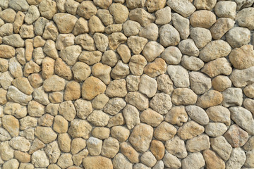 yelow oval stones in the wall like background