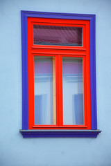 Beautiful window on color wall