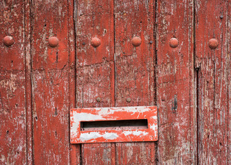 old decaying grunge background letterbox on door