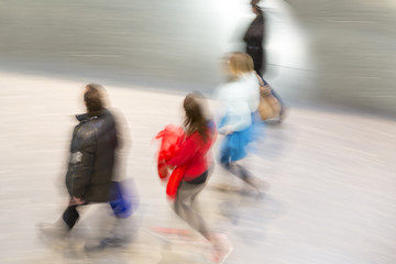 People stream in modern interior, motion blur