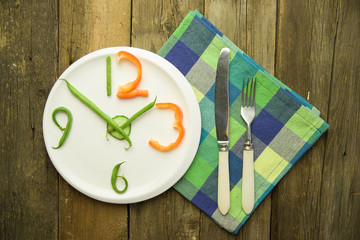 Watch made from vegetables are on the plate