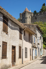 Fototapeta na wymiar Old street of historical part of Carcassonne below the castle fortress 