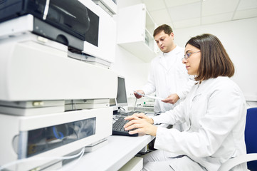 Researchers analyzing liquid chromatography data