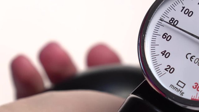 Tonometer for the measurement of blood pressure, on white, close up