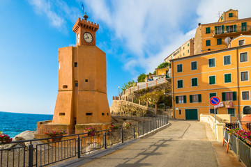 Main square and lighthouse architecture in Rio Marina, on the coast of Elba island - Italy