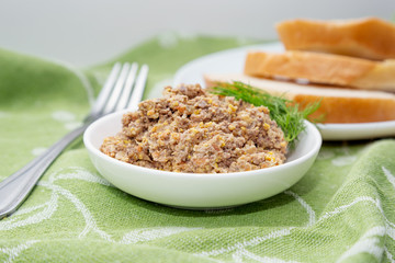 Homemade pate from a liver, carrots, garlic and eggs with dill o