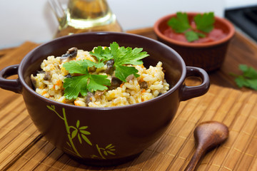 Pilaf with mushrooms, carrot and parsley