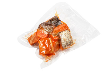 vacuum packed pieces of salmon on the white background with clipping path - 117590340