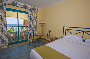 Interior of a luxury hotel room with balcony