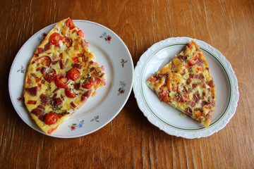Scrambled eggs with red pepper,tomatoes,sausage.