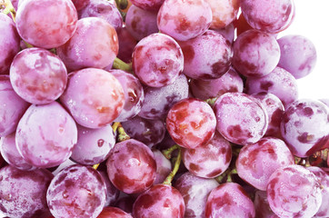 Closeup fresh red grapes on white background, food and drink concept