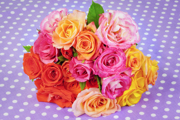 Rose bouquet of different colors on the table