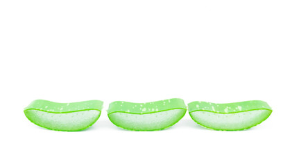 Closeup fresh aloe vera slice on white background, beauty and healthy care concept, selective focus