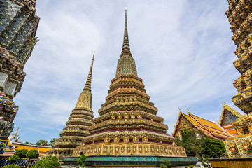 Stupas of Wat Po Buddhist temple complex in Bangkok, Thailand.