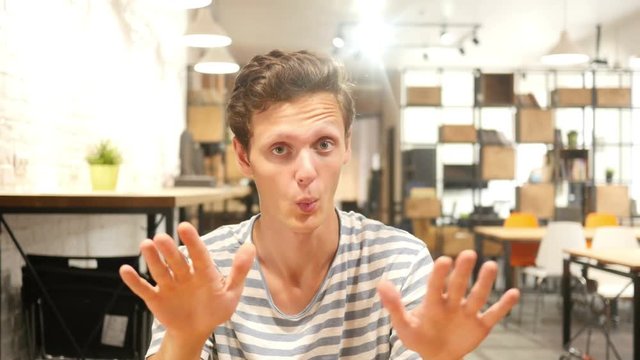 young man saying stop; denial gesture , rejecting , no