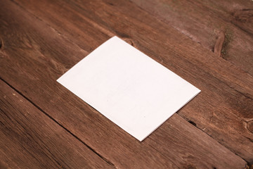 sheet of paper on a wooden background