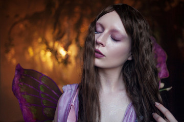 Fototapeta na wymiar Young beautiful woman in the image of fairies, close up