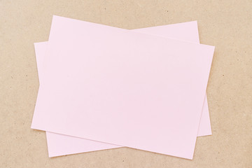 Office table with pink paper sheets