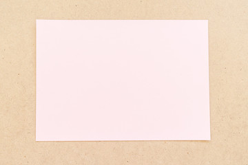 Office table with pink paper sheet