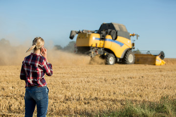 female farmer using electronics