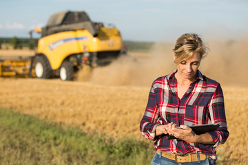 female farmer using electronics