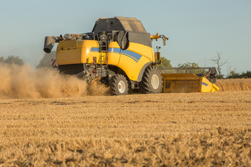 female farmer and combine harvester