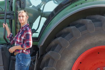 Female farmer and her tractor