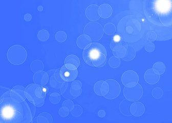 White circles on blue bokeh with lens flare