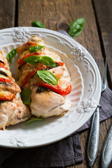 Baked chicken breast with mozzarella and cherry tomatoes with basil