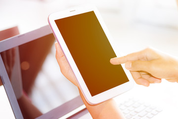 Close Up of woman's hands using mobile phone and coffee with blank copy space screen for your advertising text message or content, in the morning light.