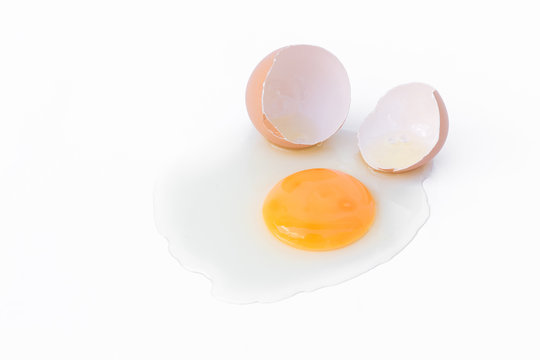Broken egg on white background, food concept