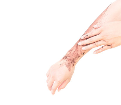 Woman's hand with scrub coffee grounds on skin hand and arm, beauty and healthy care concept
