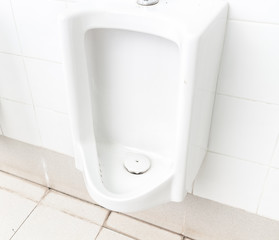 Fototapeta premium Closeup urinals white color in men's public restroom, healthy concept