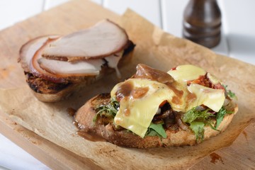 Pork sandwiches on a wooden background