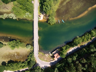 Top view at transportation bridge across river Crnojevica in Rjieka Crnojevica town. Area of national park in Montenegro