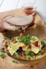 Pork sandwiches on a wooden background