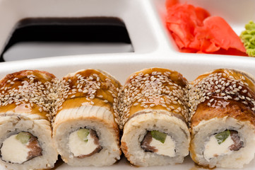 sushi rolls in white plate closeup