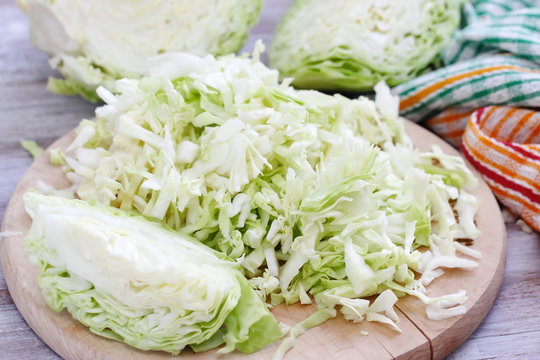 Fresh cabbage and other vegetables on the table