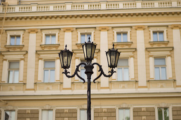 Detail of retro styled street lantern on background of vintage building