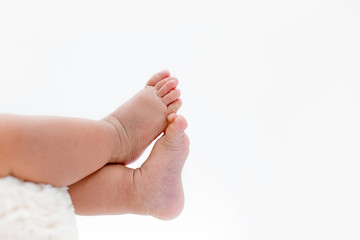 newborn baby feet isolated on white